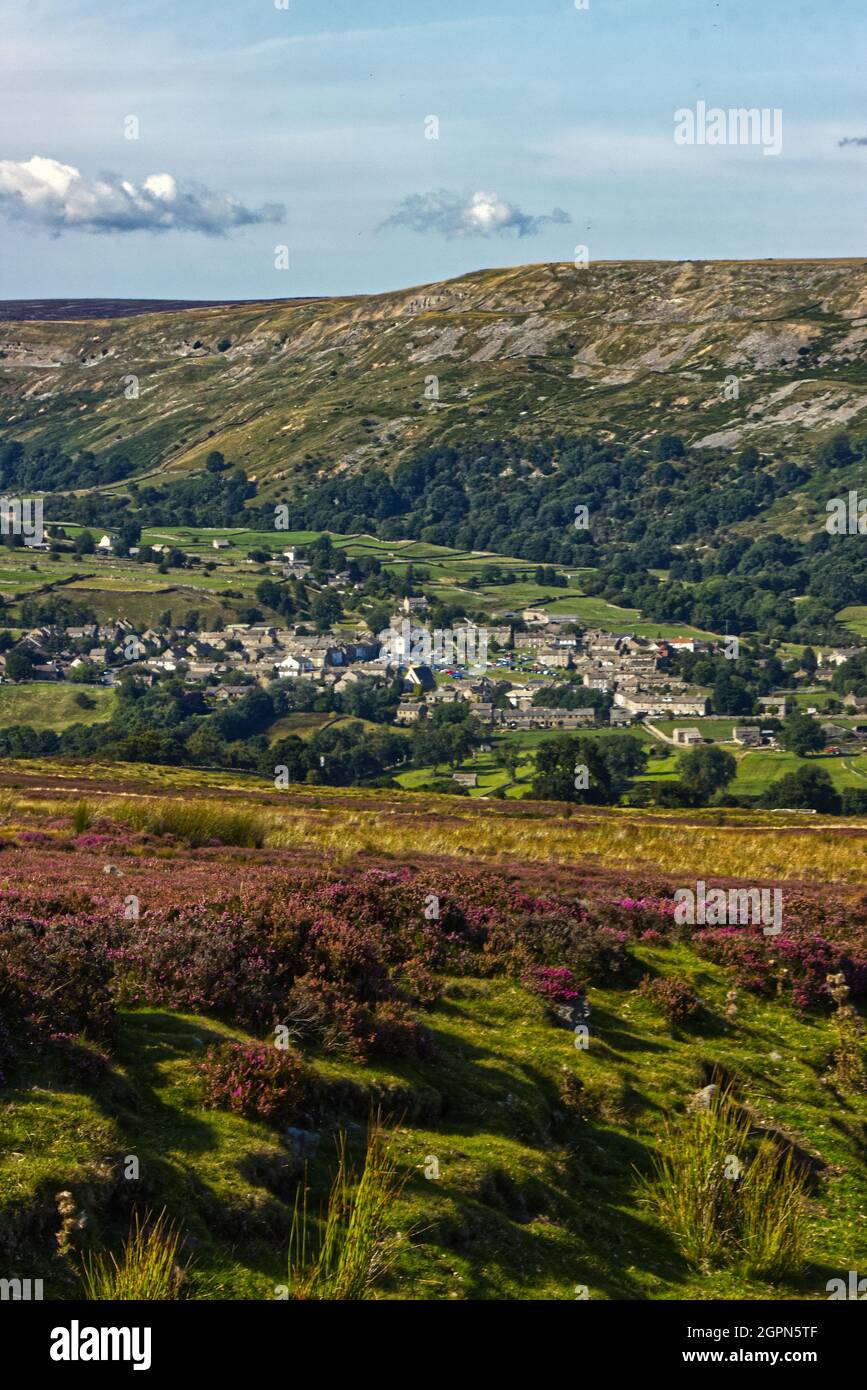Reeth View of the village of Reeth, from Grinton moor with heather in flower ...