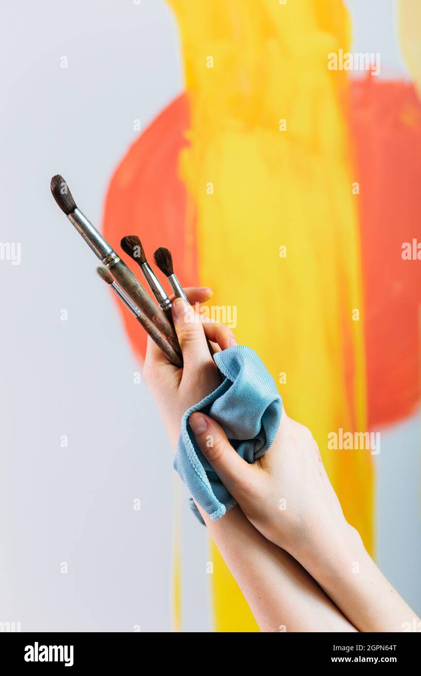 Holding painting brushes hires stock photography and images Alamy