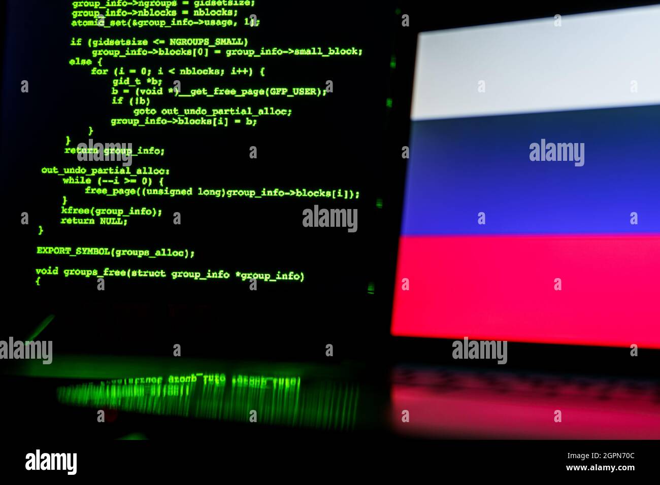 Russian anonymous hackers. Russian flag and programming code in ...