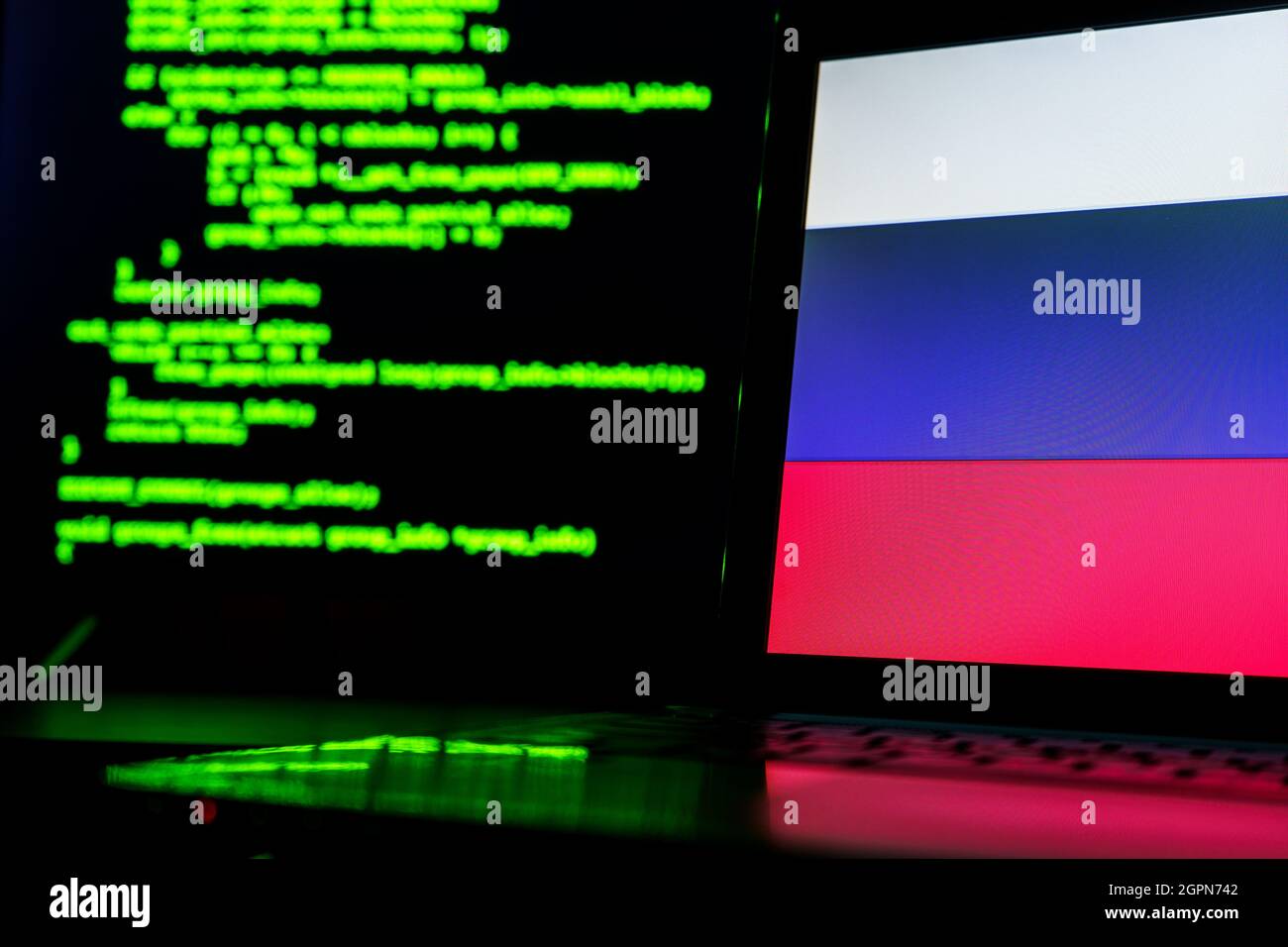 Russian anonymous hackers. Russian flag and programming code in ...