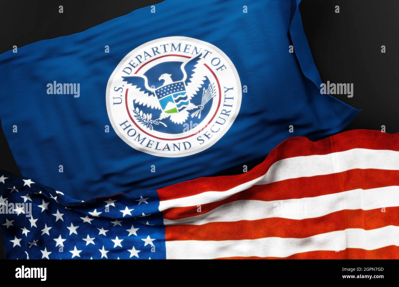 Flag of the United States Department of Homeland Security along with a flag of the United States of America as a symbol of a connection between them, Stock Photo