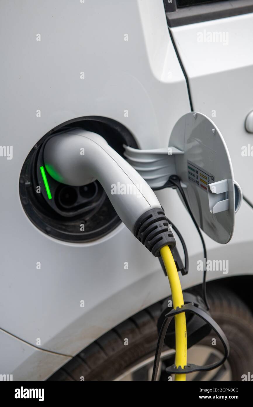 Electric car charging at home Stock Photo Alamy