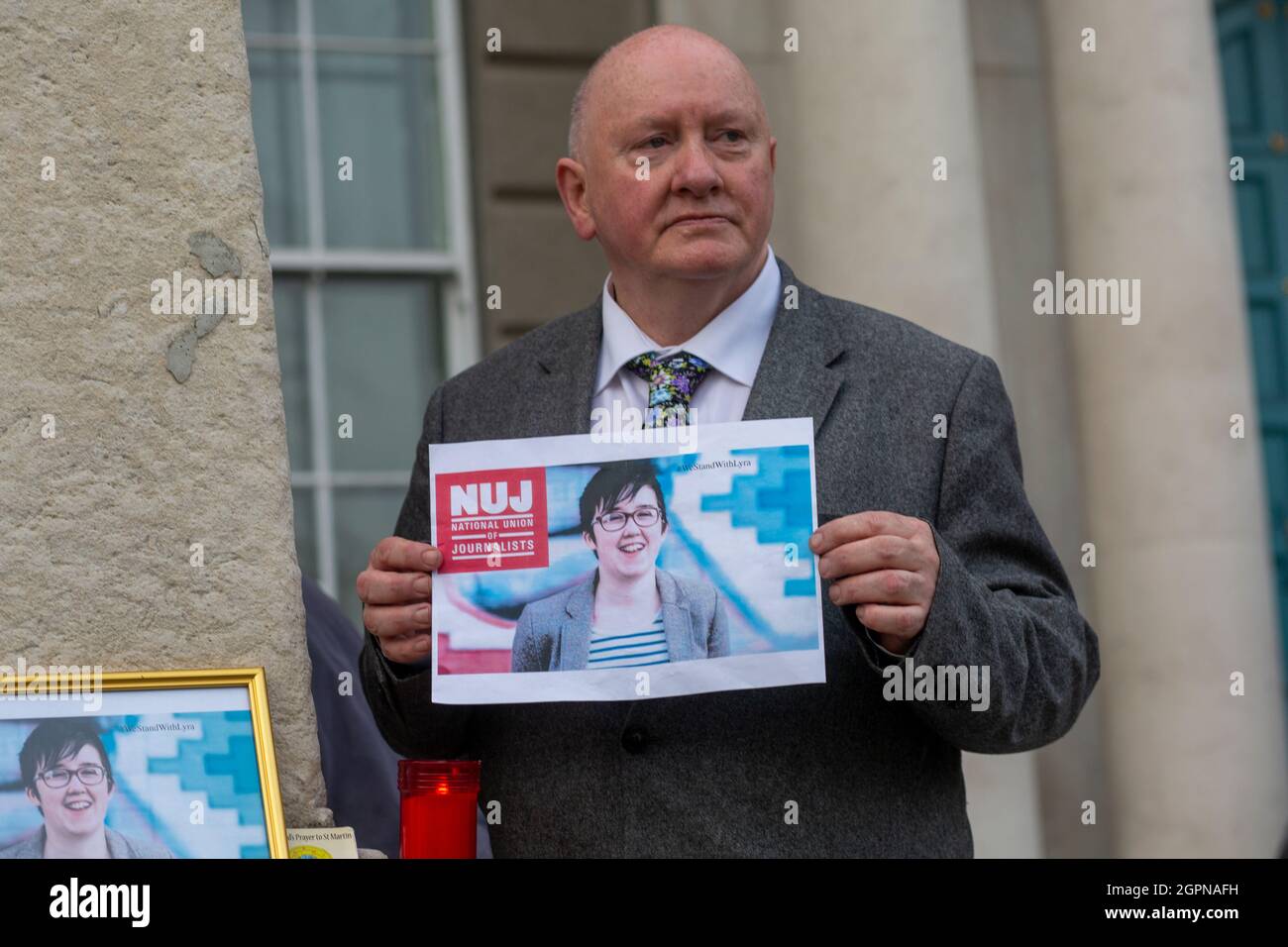 Irish journalist, Seamus Dooley, holds a picture of Lyra McKee after a vigil in her honour in Dublin. Stock Photo