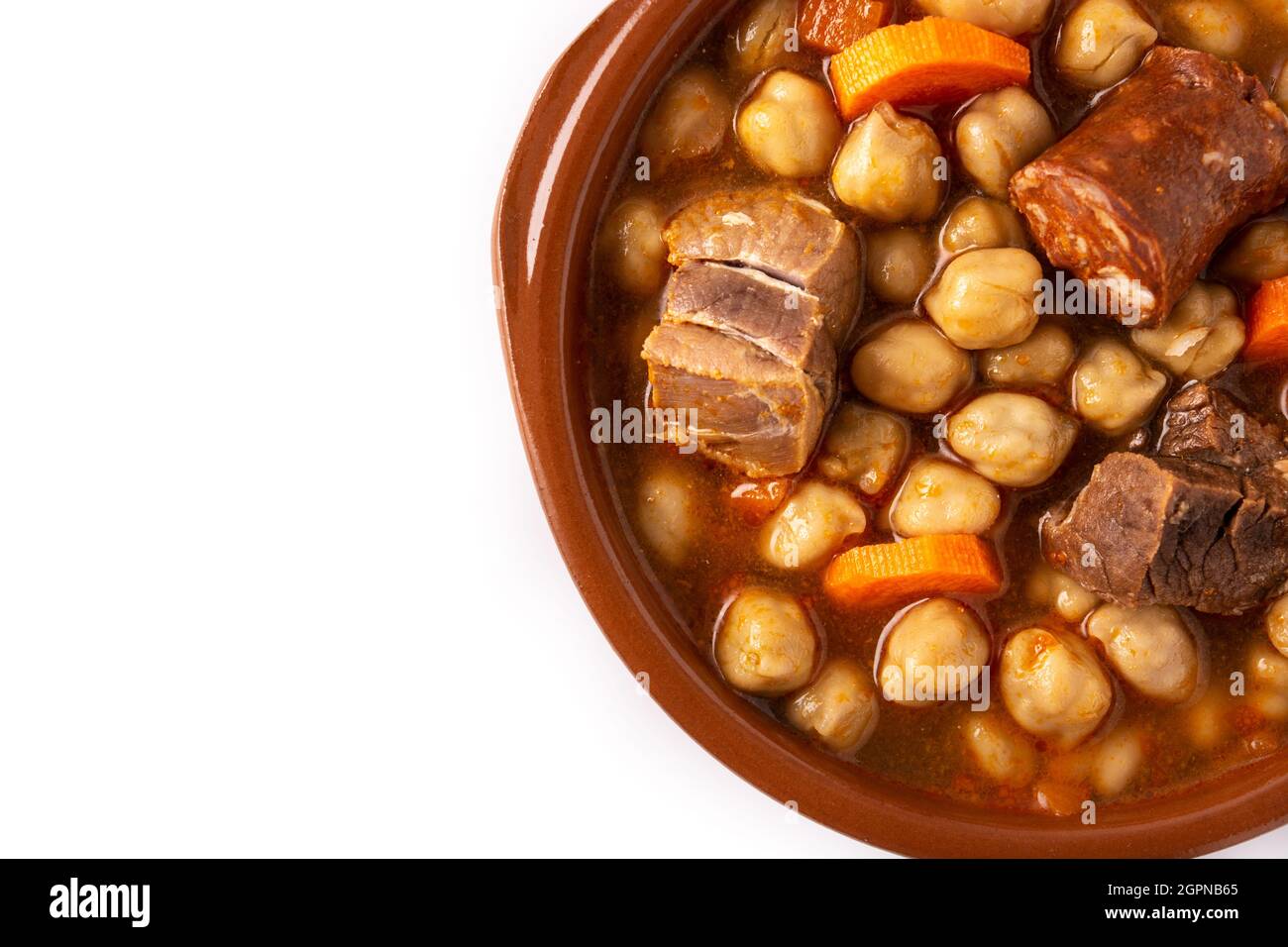 Traditional Spanish cocido madrileño in bowl isolated on white ...