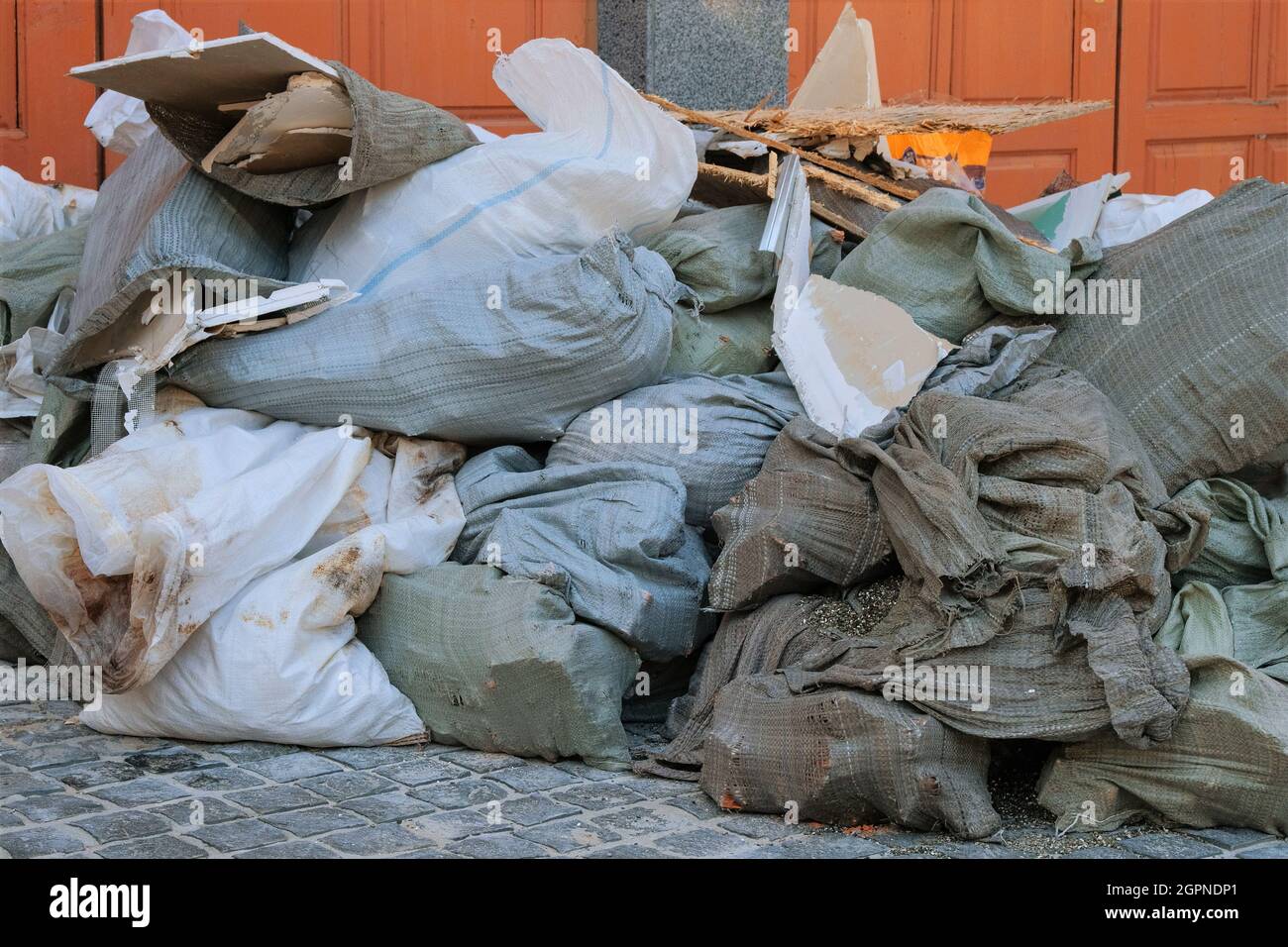 Construction garbage after building repair in bags. Removal of debris