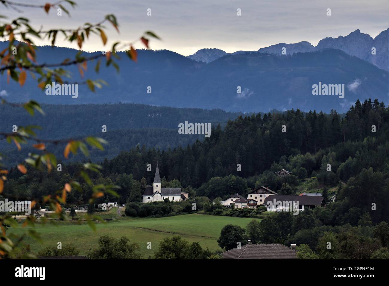 Austrian village called 'Pirk' (carinthia, austria) with church in front. Stock Photo
