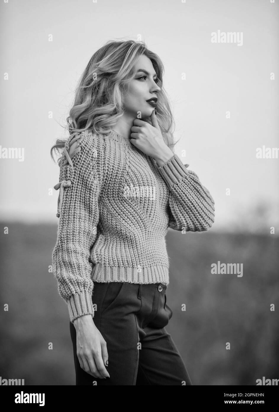 Style is all about balance. Gorgeous lady feeling cozy in woolen sweater. Trendy clothes. Woman warm sweater nature background defocused. Elegance Stock Photo