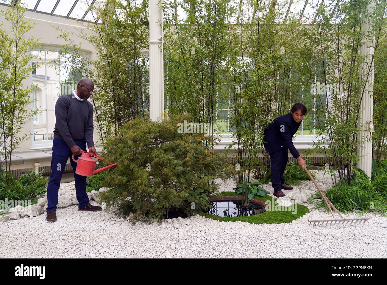 Otis Roberts (left) and Yuichi Kodai put the finishing touches to their chalk garden during a photocall for the Japan Festival, which is a celebration of the country's breath-taking plants, art and culture, at the Royal Botanic Gardens, Kew, London. Picture date: Thursday September 30, 2021. Stock Photo