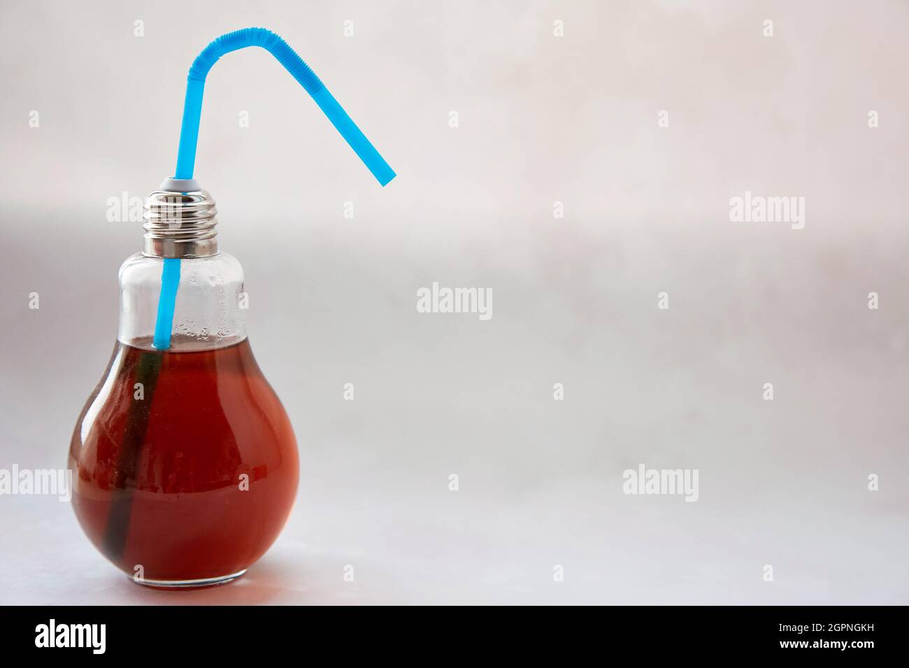 Creative bulb glass with cocktail. Power, science, bitcoin