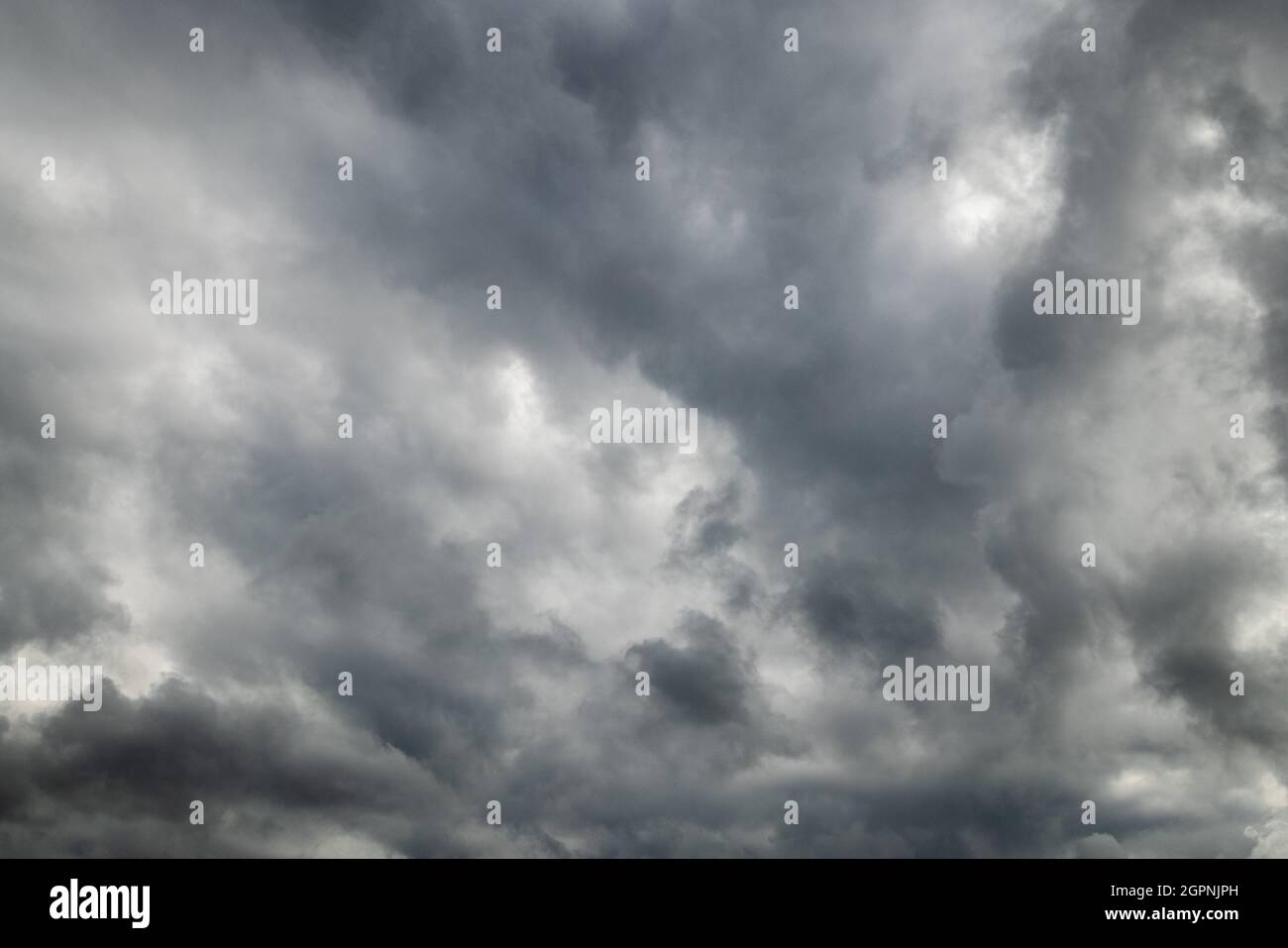 grey incoming storm clouds full frame background Stock Photo