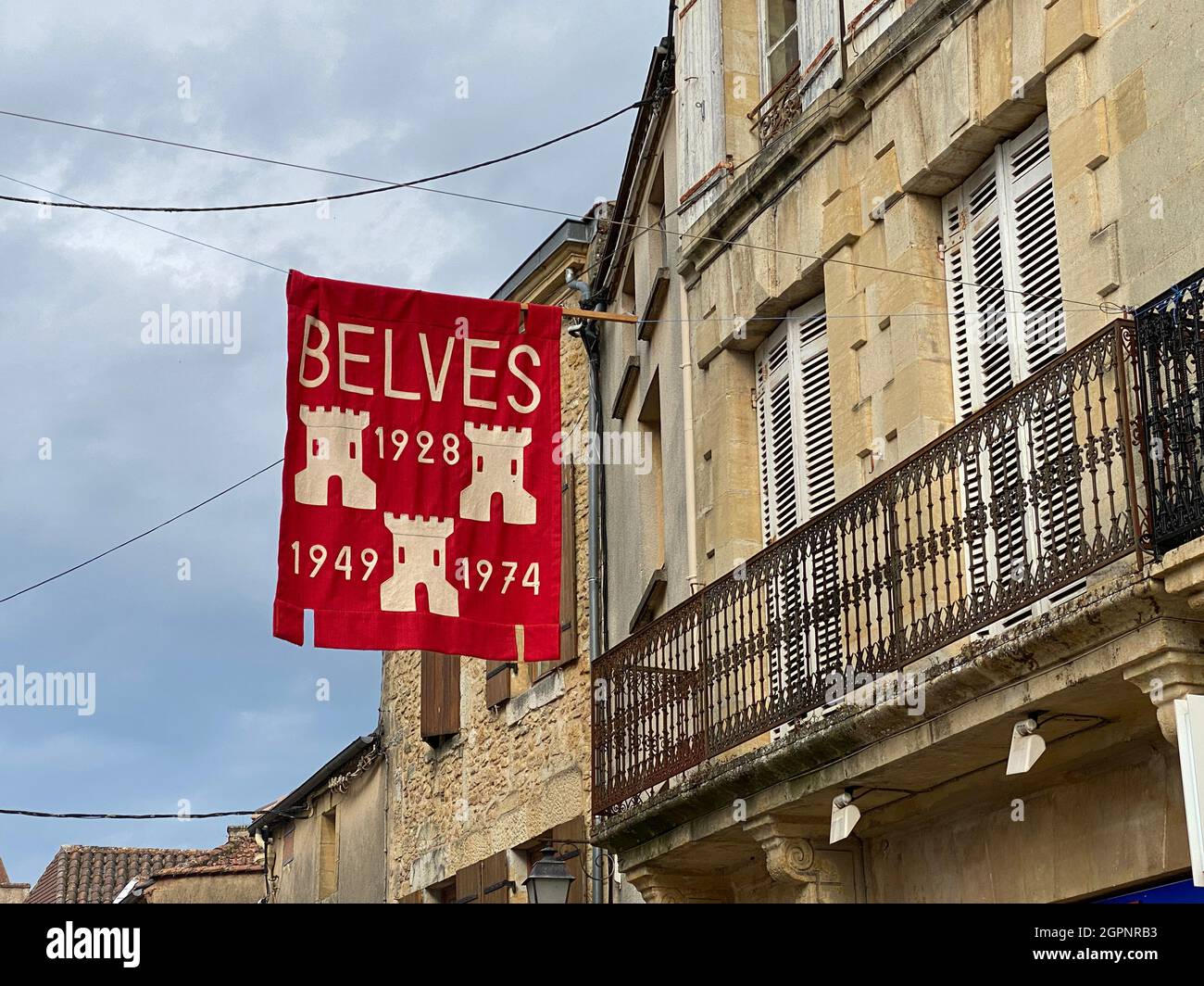 Belves town sign hanging in the street. Belves is onr of the prettiest towns in France Stock Photo