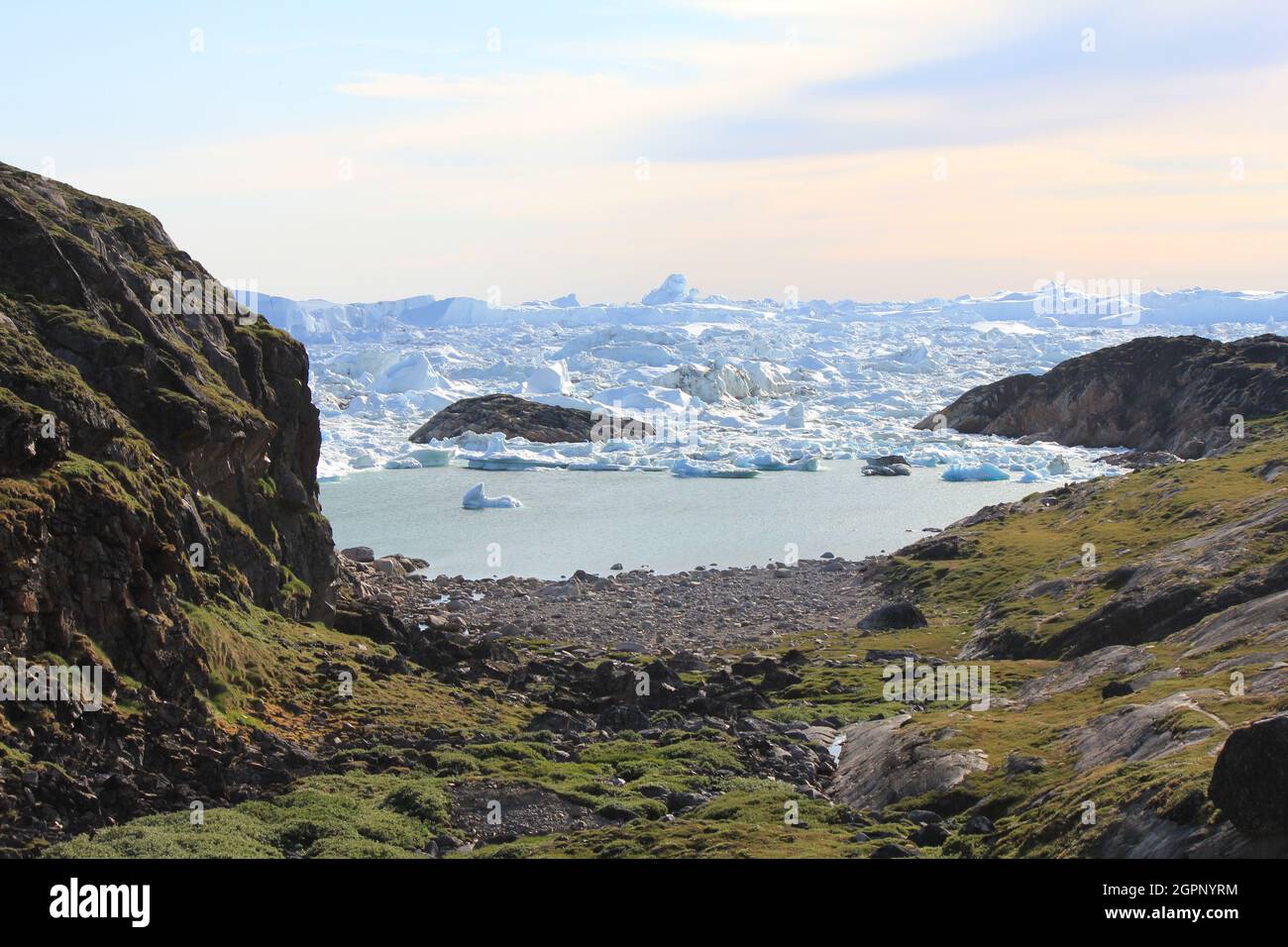 Greenland Coastal Rocks Coastal scenery with icebergs, Greenland Stock Photo - Alamy