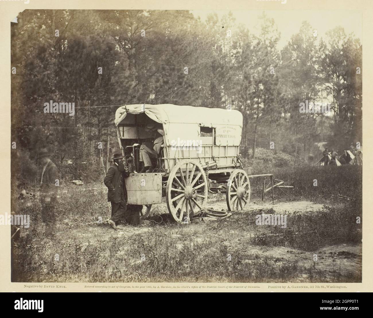 Field Telegraph, Battery Wagon, September 1864. [Scene from the American  Civil War: covered wagon with 'US Military Telegraph Headquarters' written  on the side. Inside a man is using telegraphy equipment]. Albumen print,