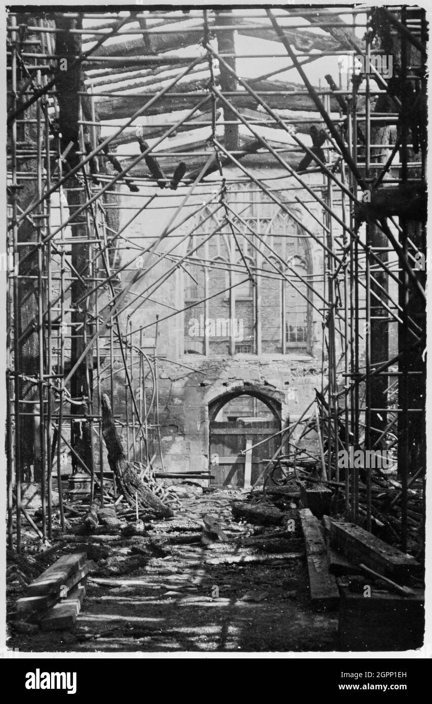 Bomb damage to the Guildhall, York, Yorkshire, World War II, 1942. Interior view of the Guildhall showing oak columns standing amid the ruins of steel scaffolding as a result of bomb damage during the Blitz. Stock Photo