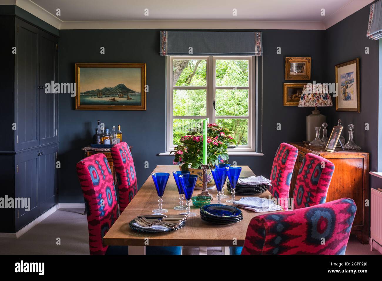 Rosewood fabric in north facing Hampshire dining room, UK Stock Photo
