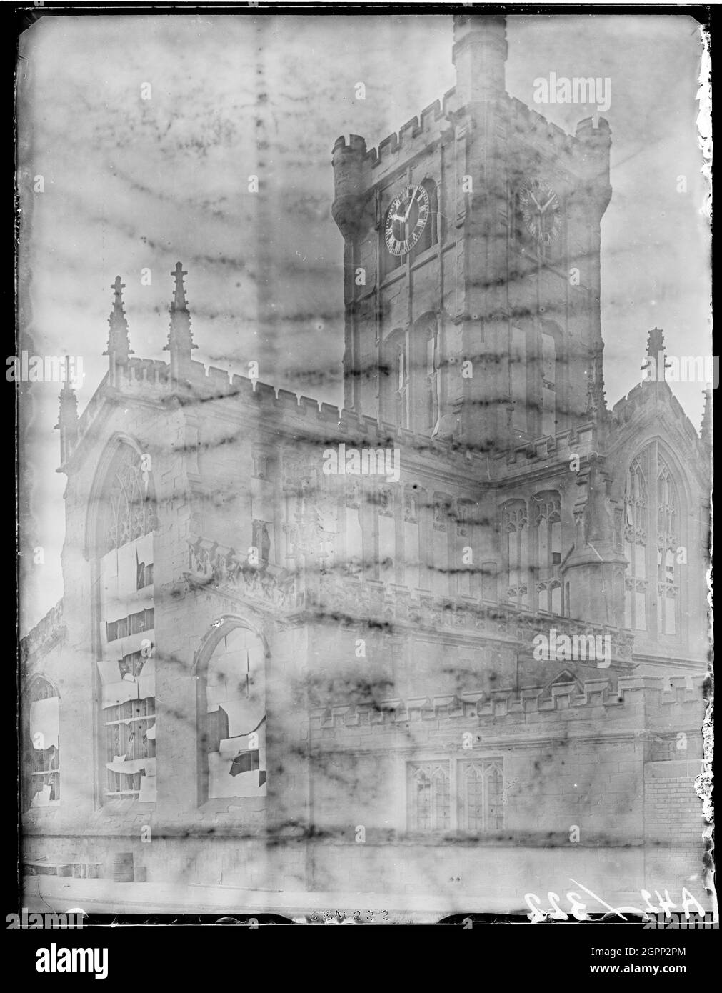 St John the Baptist's Church, Fleet Street, Bablake, Coventry, 1941. The east end of St John the Baptist's Church viewed from the north east (Hill Street) showing windows boarded as a result of bomb damageDuring the Coventry Blitz St John's, Bablake suffered bomb damage to its windows and roof. Stock Photo