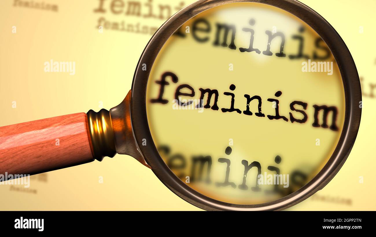 Feminism and a magnifying glass on English word Feminism to symbolize studying, examining or searching for an explanation and answers related to a con Stock Photo