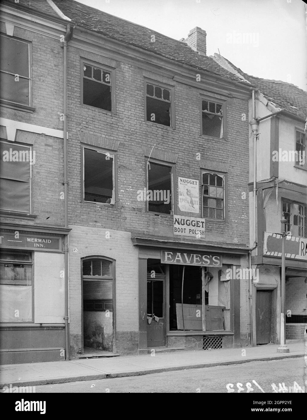 Gosford Street, Coventry, 1941. View showing part of the Mermaid Inn and the premises of Eaves's at 110 Gosford Street showing bomb damage. Coventry City centre was devastated by air raids on 14th November 1940. The bombing raids left the nearby cathedral in ruins and destroyed much of the historic fabric of the city. Stock Photo