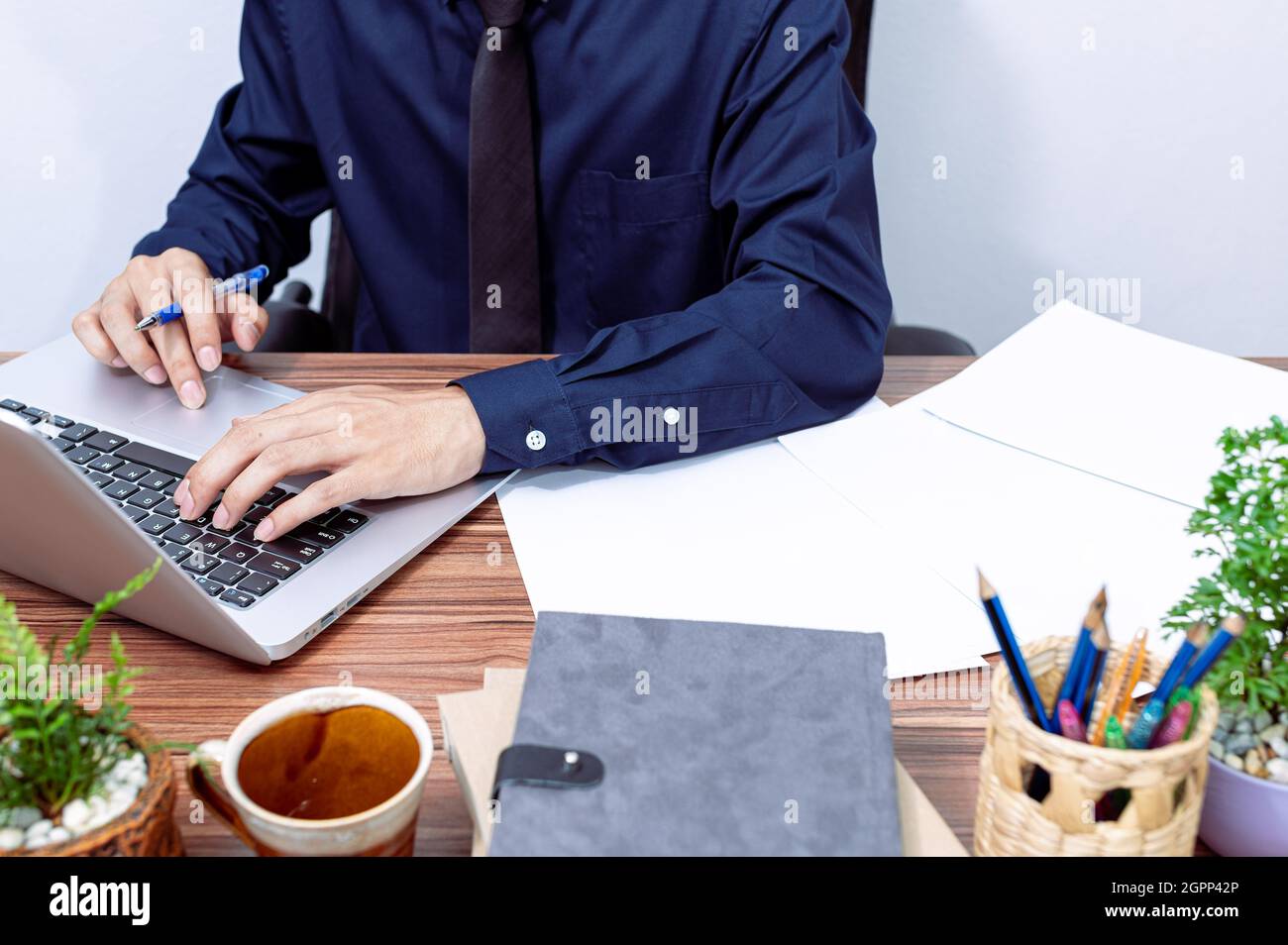 Business people use computers to work at their desks Stock Photo - Alamy