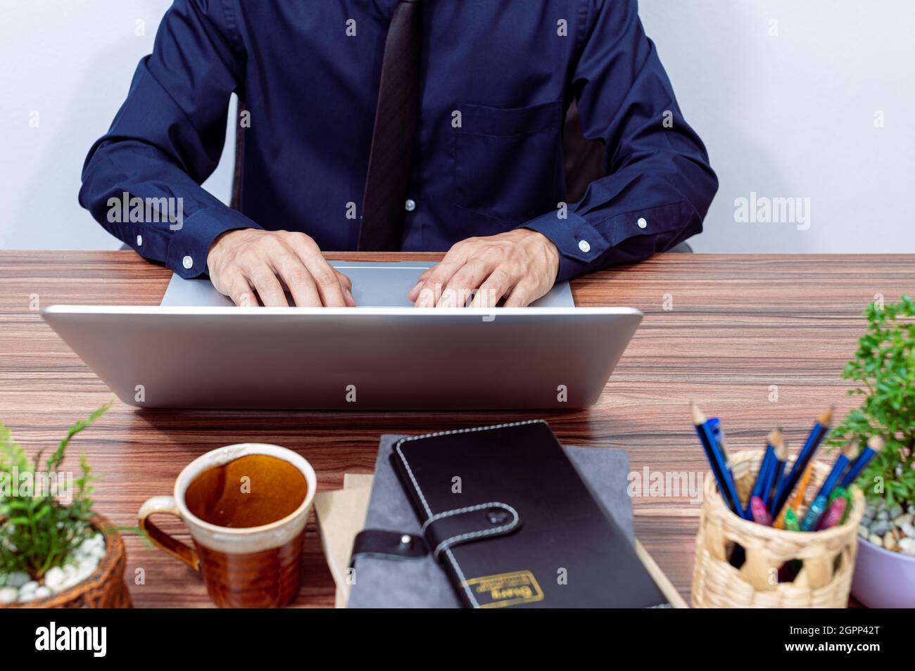 Business people use computers to work at their desks Stock Photo - Alamy