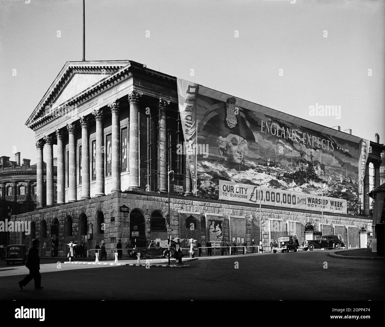 Town Hall, Victoria Square, Birmingham, 1941. A view showing Birmingham Town Hall, draped with a large banner encouraging people to donate to Warship Week, during which the city hoped to raise &#xa3;10,000,000 to sponsor HMS King George V. Stock Photo