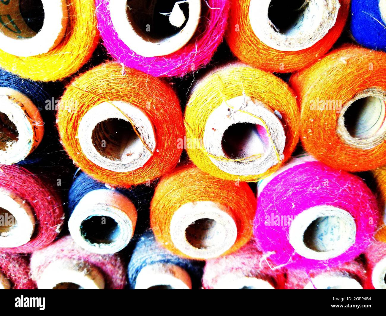 A shop display of colored sewing thread cone Stock Photo Alamy