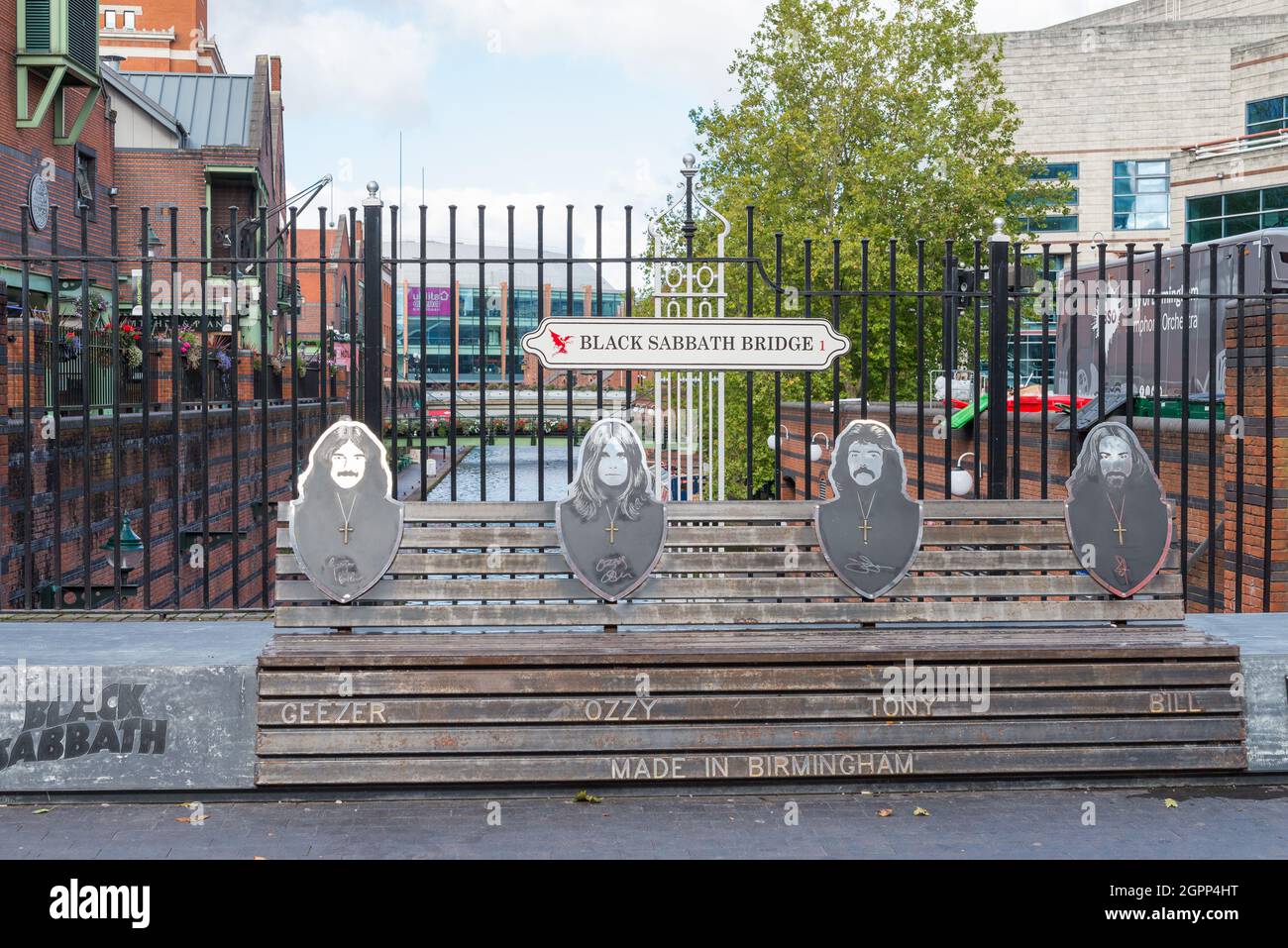 Black Sabbath bridge on Broad Street, Birmingham celebrates the local band  with pictures of them on a bench Stock Photo - Alamy
