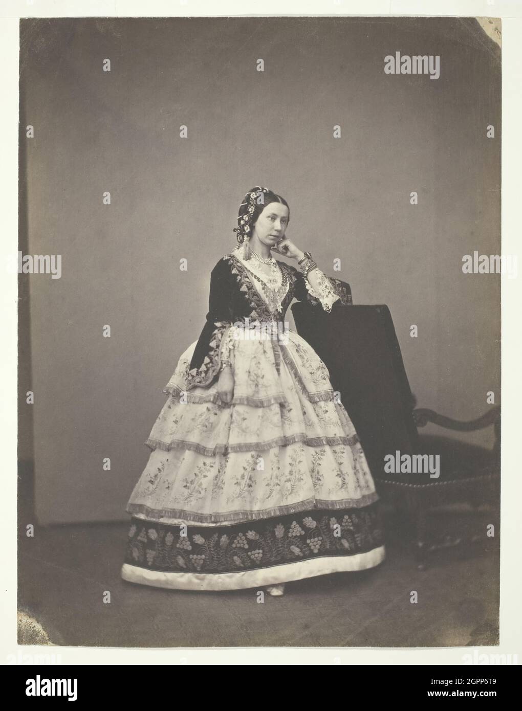 Madame Carrelle, 1856/57. [Woman wearing embroidered dress with fitted bodice and lace sleeves]. Salted paper print. Stock Photo