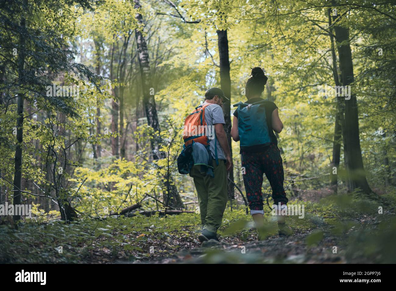 Couple on a hike in the woods Stock Photo - Alamy
