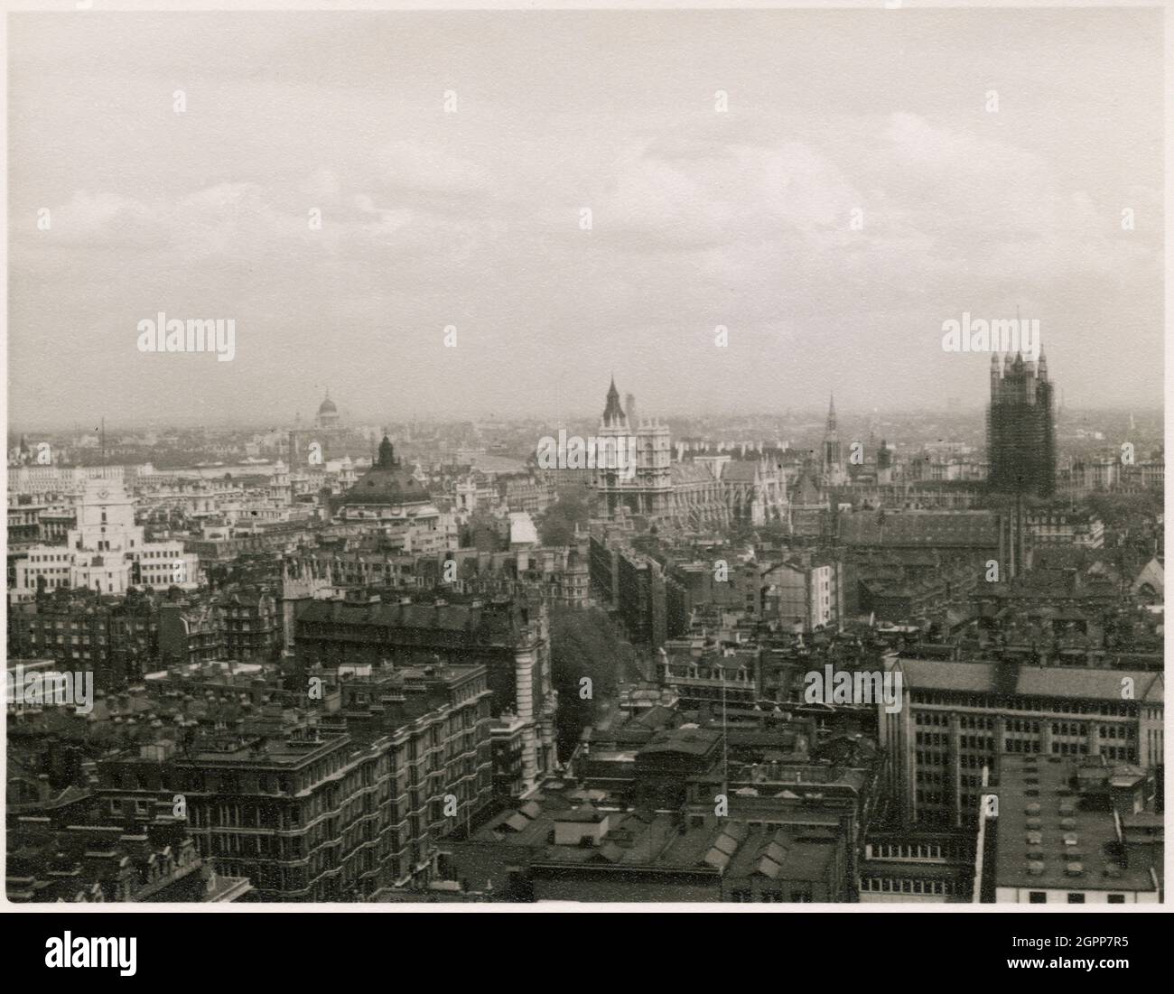 City of Westminster, Greater London Authority, 1950-1955. A view looking north-east across Westminster from the tower of Westminster Cathedral, showing St James' Park station, the Methodist Central Hall, Westminster Abbey and Victoria Tower of the Houses of Parliament. The campanile or tower of Westminster Cathedral is 284ft tall, and has a viewing gallery near its top. The Rose Tower of the Houses of Parliament, shown on the right of this photograph, was restored between 1936 and the early 1950s. Stock Photo