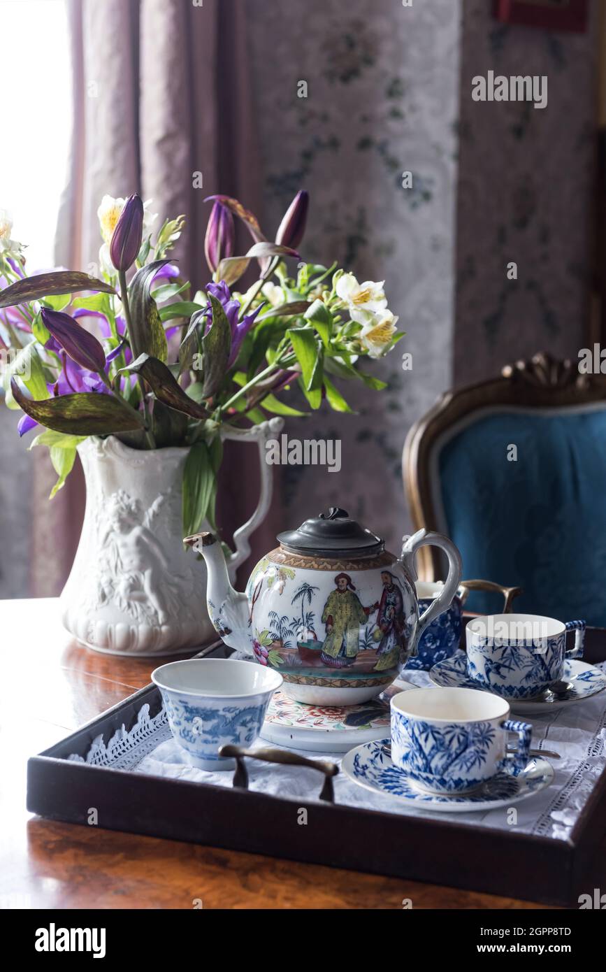 Cut flowers and Victorian tea tray in Benedict's B&B, St Leonards-on-Sea Stock Photo