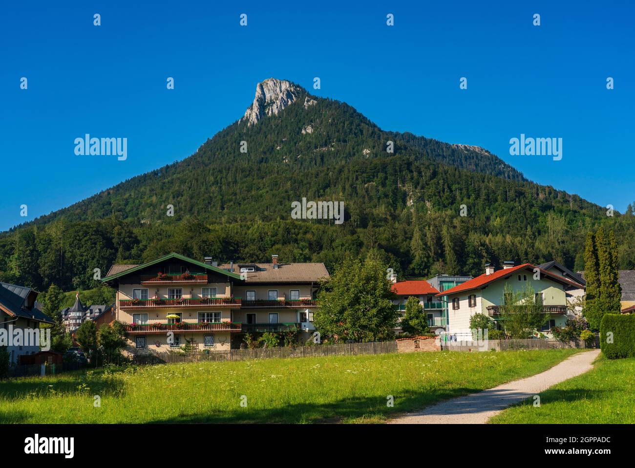 Austria, Fuschl am See, Houses with mountain in background Stock Photo