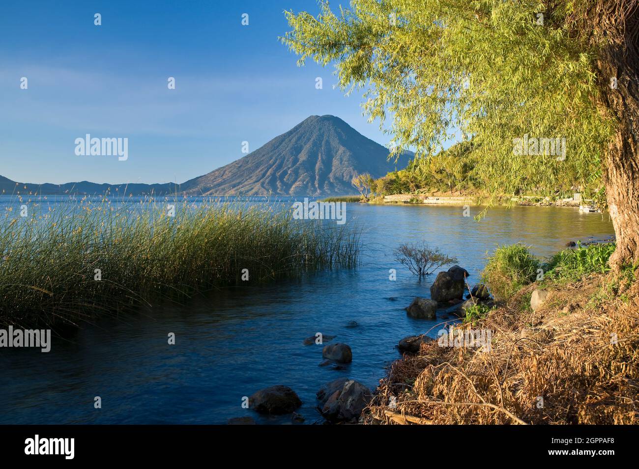 Guatemala, Western Highlands, Lake Atitlan with Volcan San Pedro in background Stock Photo