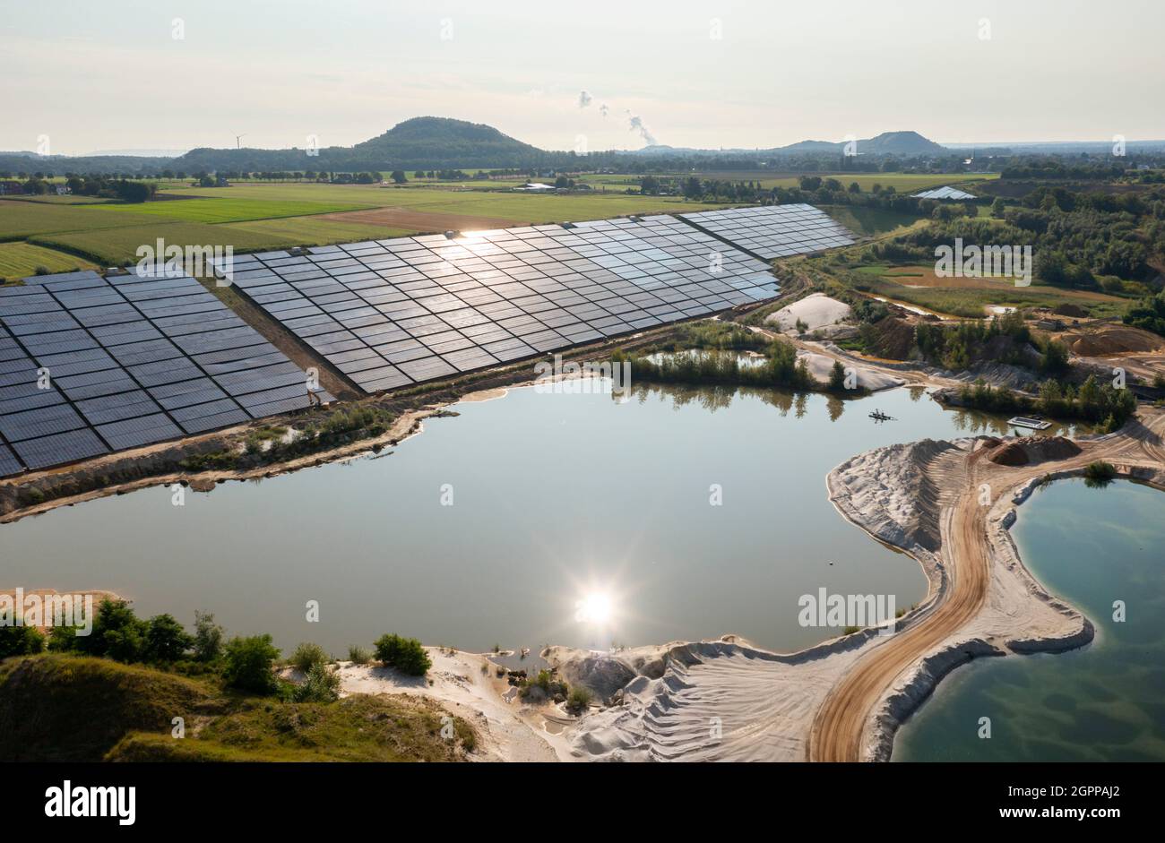 Germany, Herzogenrath, Aerial view of solar panels at sand mine Stock Photo