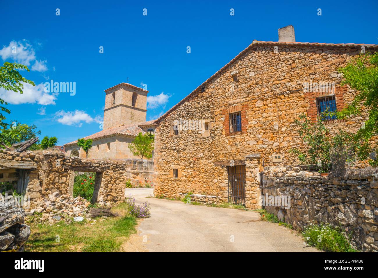 House and church. Villacadima, Guadalajara province, Castilla La Mancha, Spain. Stock Photo