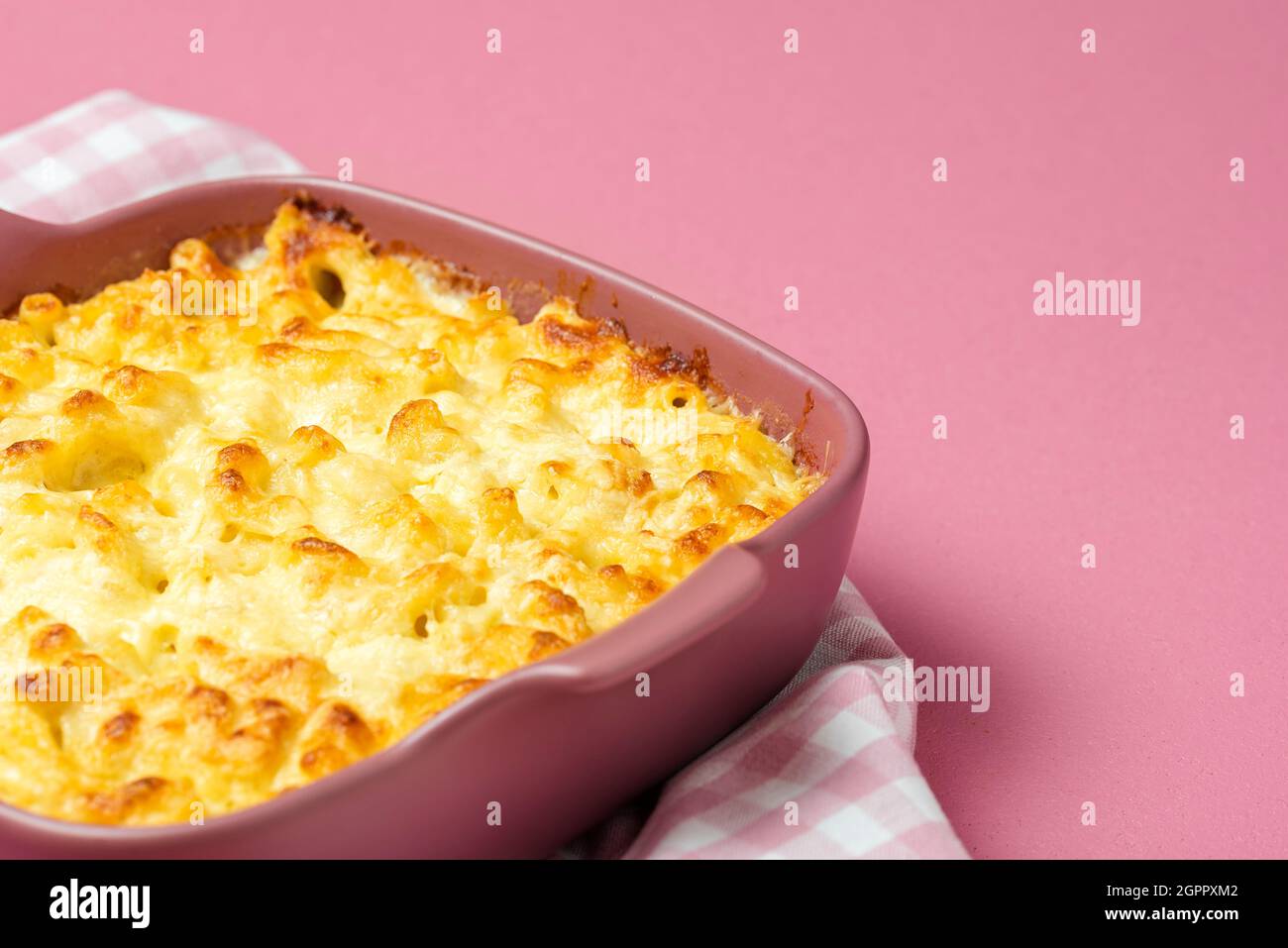 Mac And Cheese With Bechamel Sauce In A Pink Tray. Closeup, Macaroni