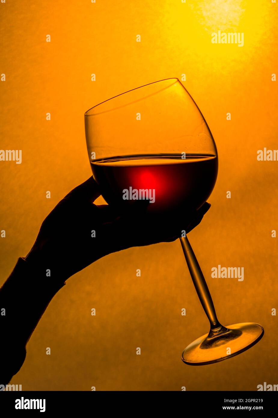 Woman holding glass of wine hi-res stock photography and images - Alamy