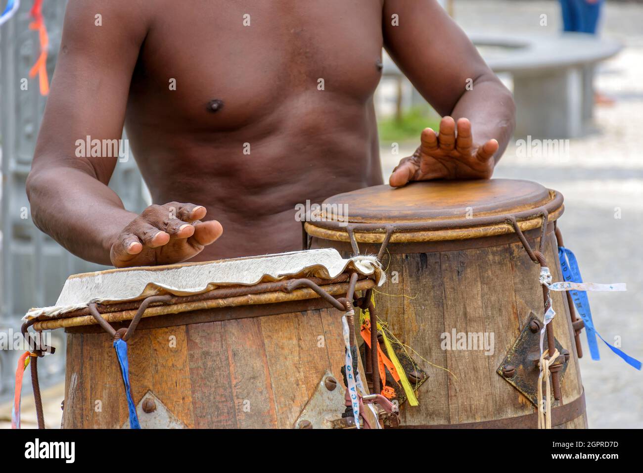 Musician playing atabaque which is a percussion instrument of African origin used in samba, capoeira, umbanda, candomble and various cultural, artisti Stock Photo