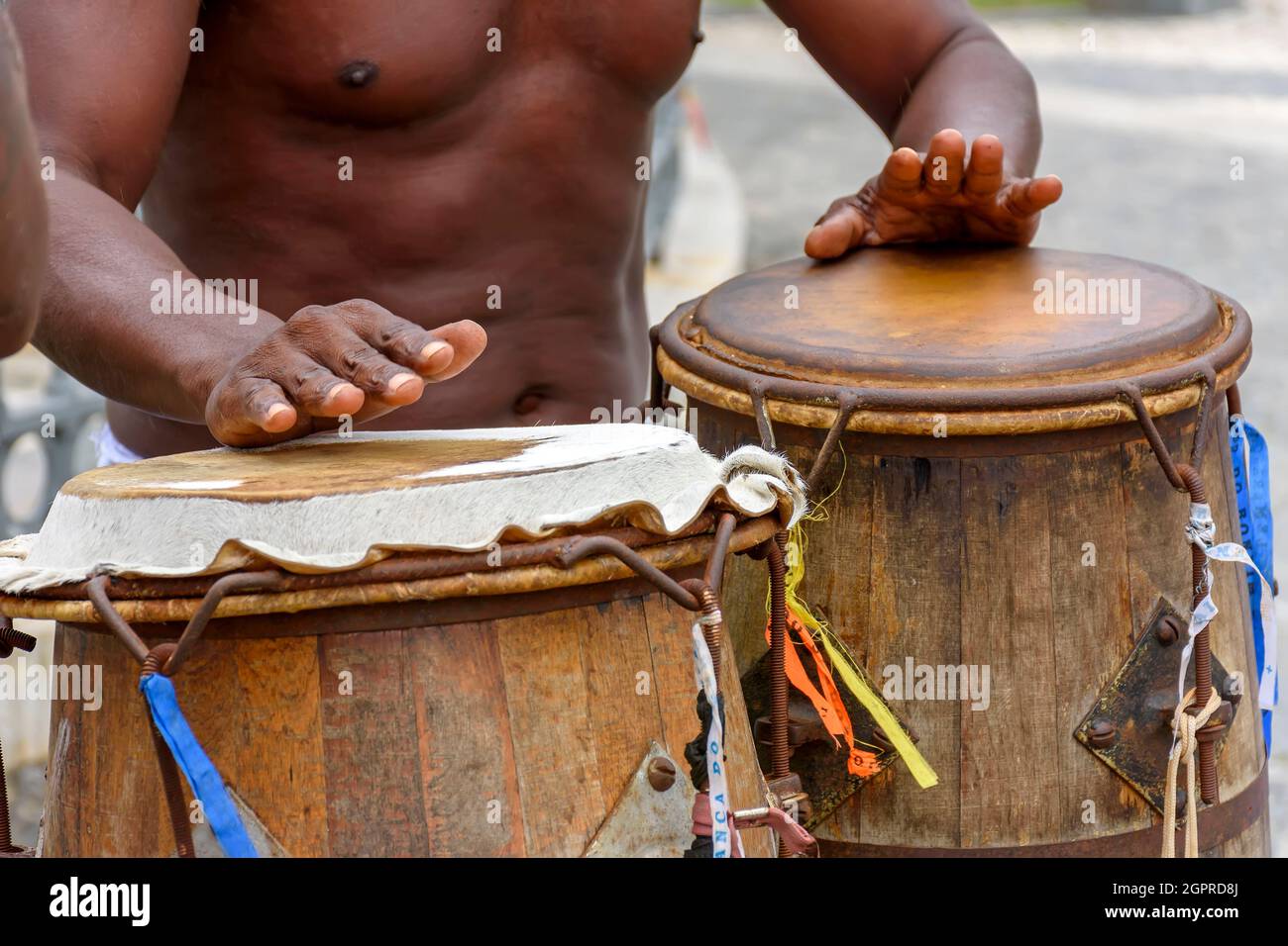 Musician playing atabaque which is a percussion instrument of African origin used in samba, capoeira, umbanda, candomble and various cultural, artisti Stock Photo