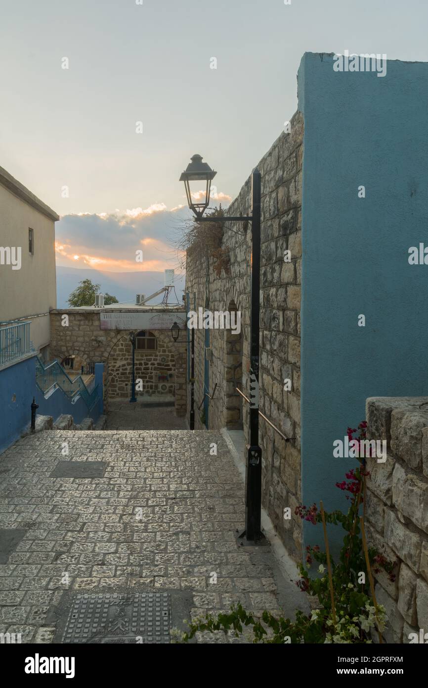 Safed, Israel - September 28, 2021: Sunset view of an alley in the Jewish quarter, the old city of Safed (Tzfat), Israel Stock Photo