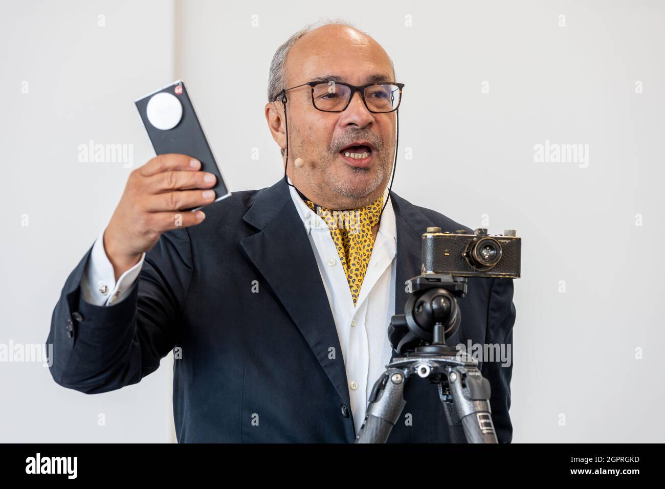 Dr. Andreas Kaufmann, current Chairman of the Supervisory Board of Leica Camera AG, is presenting the newest Leitz Phone 1 (2021) and the exhibit Leica No. 105 (1923/1924) from the Zero-Series, a camera originally owned and used by Oskar Barnack, at the press conference for the reopening of the Ernst Leitz Museum next to the Leica Camera AG headquarter in Wetzlar, Germany, 30th September, 2021. Credit: Christian Lademann / LademannMedia Stock Photo