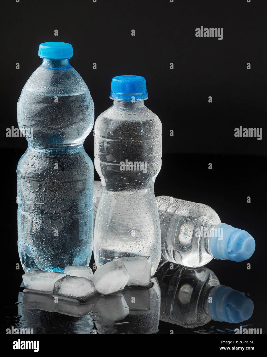 Ice cubes bottles water front view Stock Photo Alamy