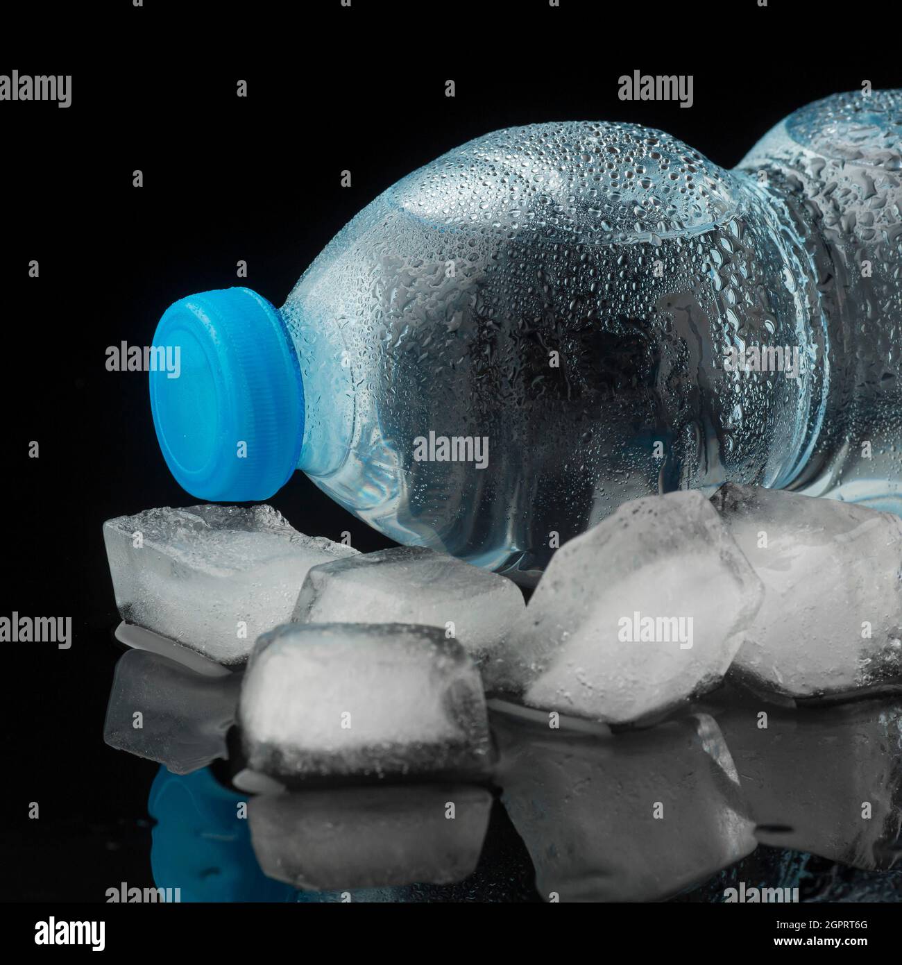 Ice cubes bottles water front view Stock Photo Alamy