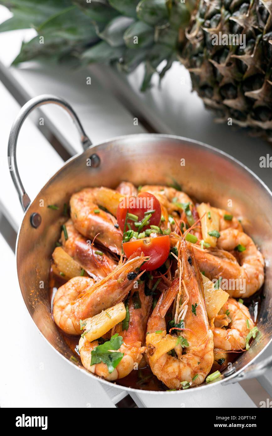spicy sauteed asian stir fry king prawns with pineapple in singapore