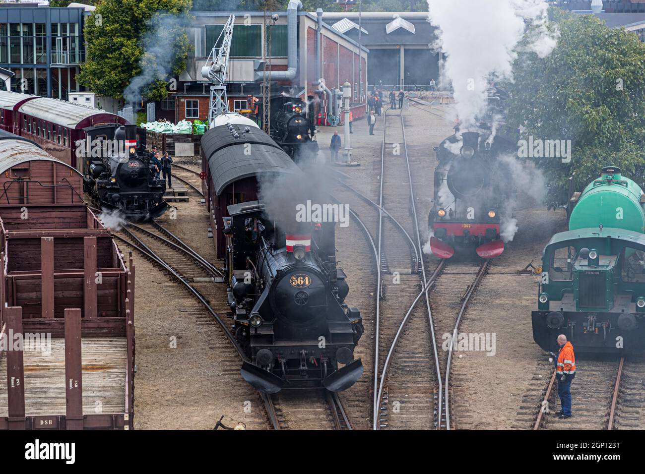 Steam locomotive meeting at the Odense Railway Museum (Jernbanemuseum) in Odense, Denmark. Due to Corona's delay of one year, the event (Dampdage 2021) commemorated the end of Danish steam locomotive operation half a century ago in 1970. Stock Photo