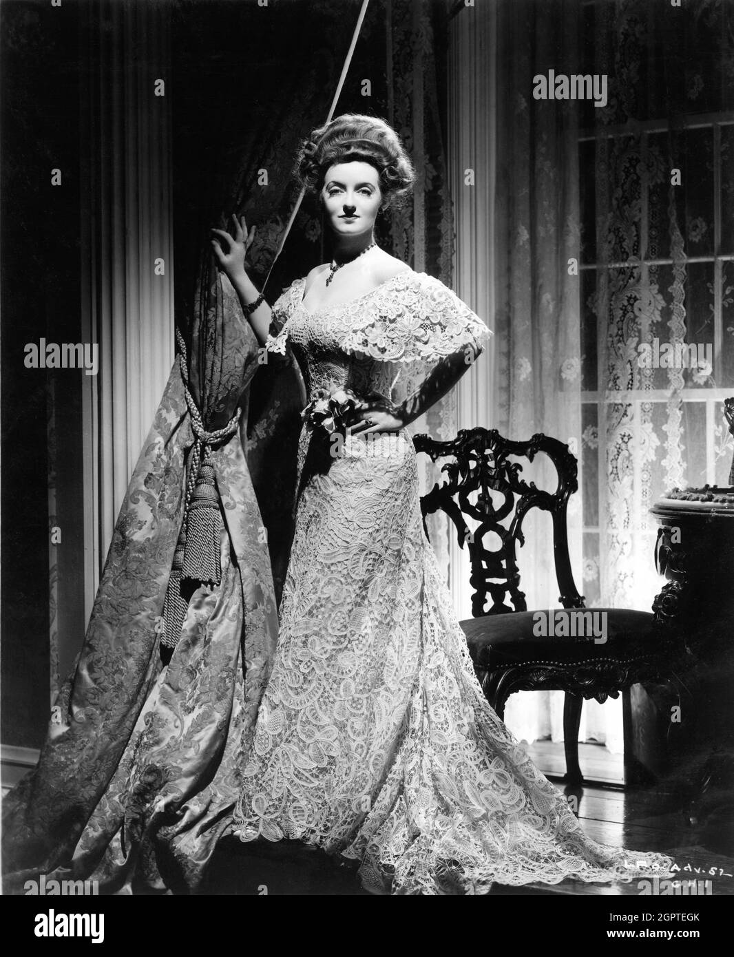 BETTE DAVIS Portrait as Regina Giddens by GEORGE HURRELL in THE LITTLE FOXES 1941 director WILLIAM WYLER play / screenplay Lillian Hellman costume design Orry-Kelly The Samuel Goldwyn Company / RKO Radio Pictures Stock Photo