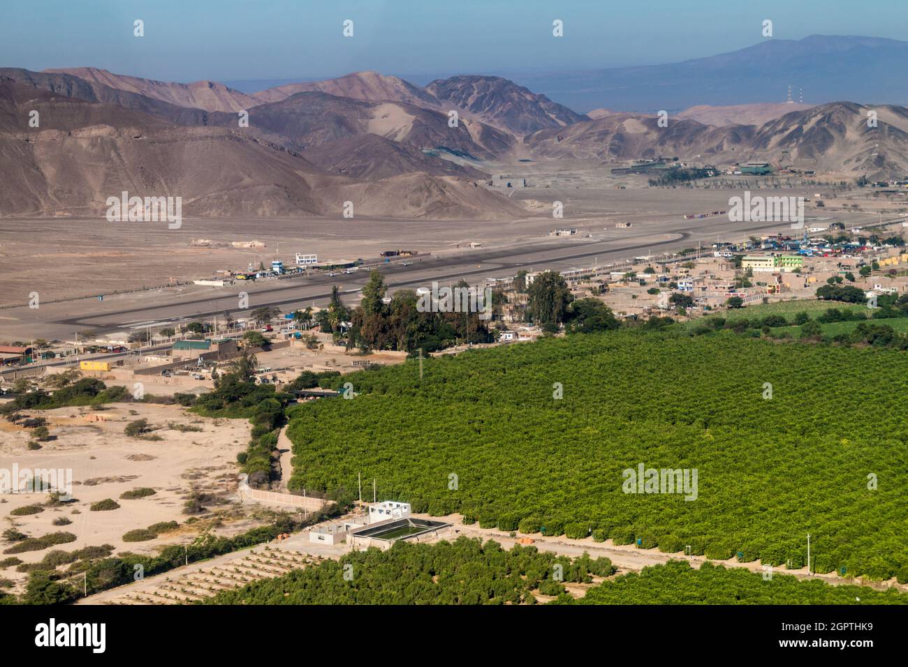 Aerial view of a green valley and the airport of Nazca, Peru. Stock Photo