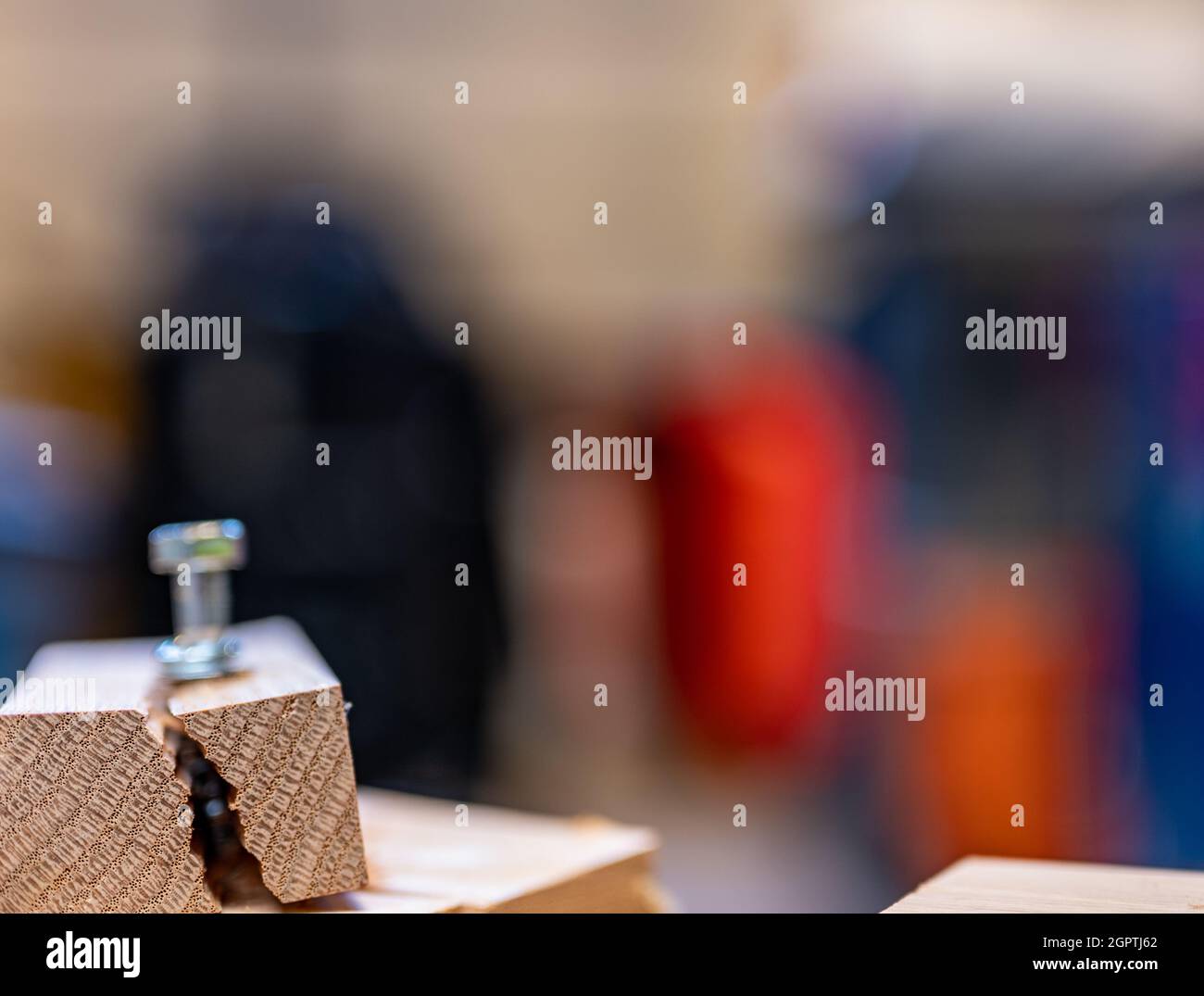 Selective focus on cracked and split wood from not drilling a pilot