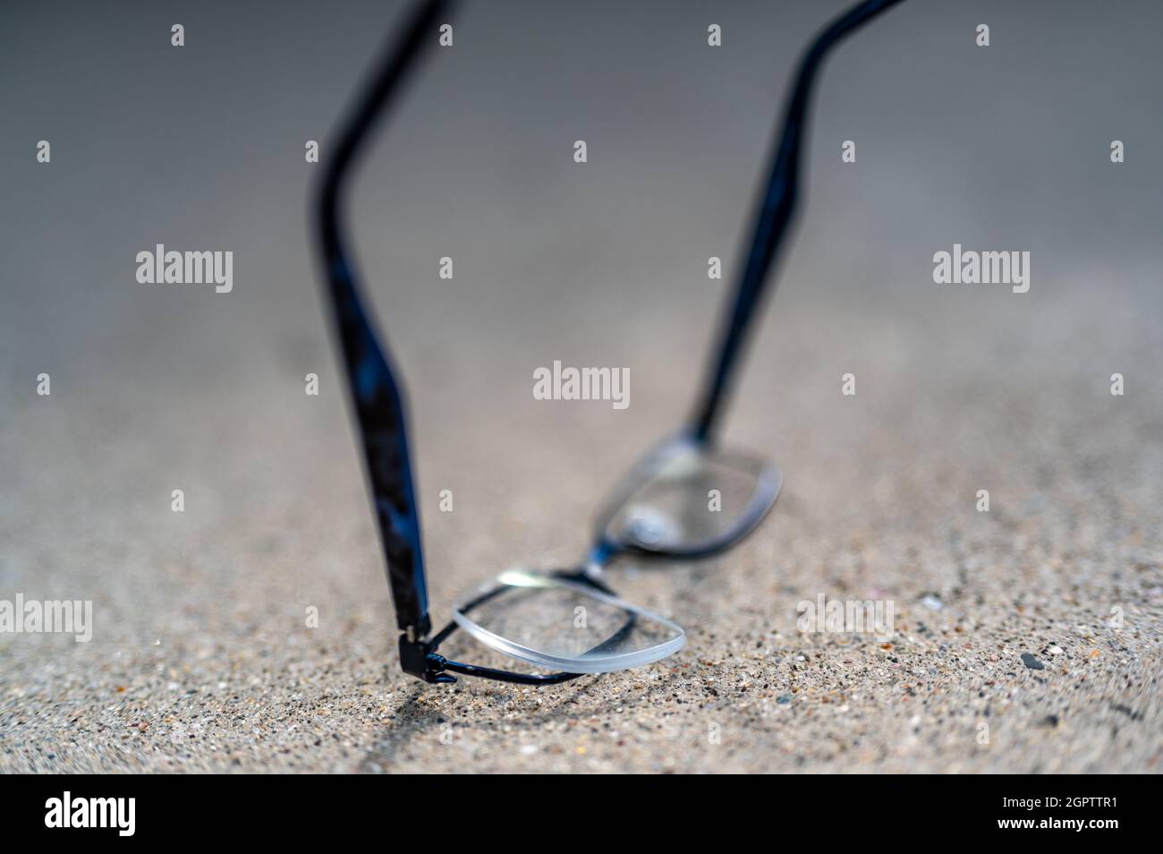 Selective focus on damaged glasses with scratched lens popped out Stock