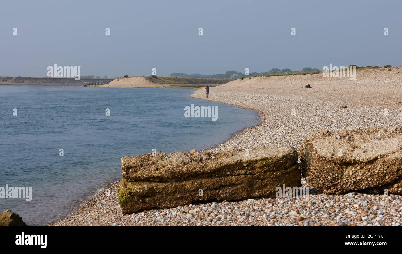Angler seen beach fishing in Pagham, UK Stock Photo - Alamy